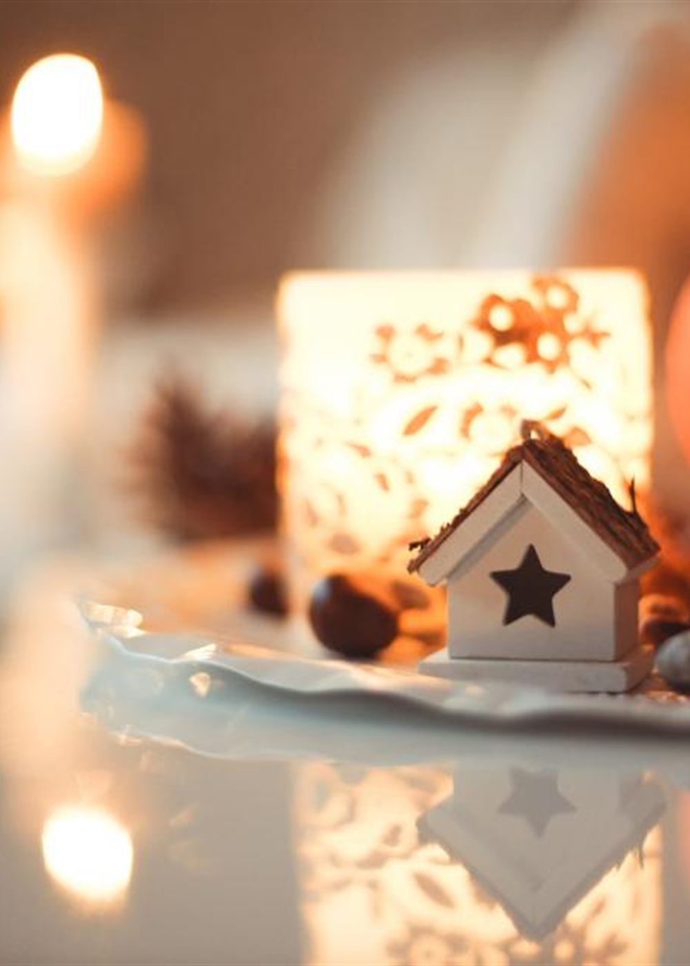 Candles glowing warmly in a softly lit room