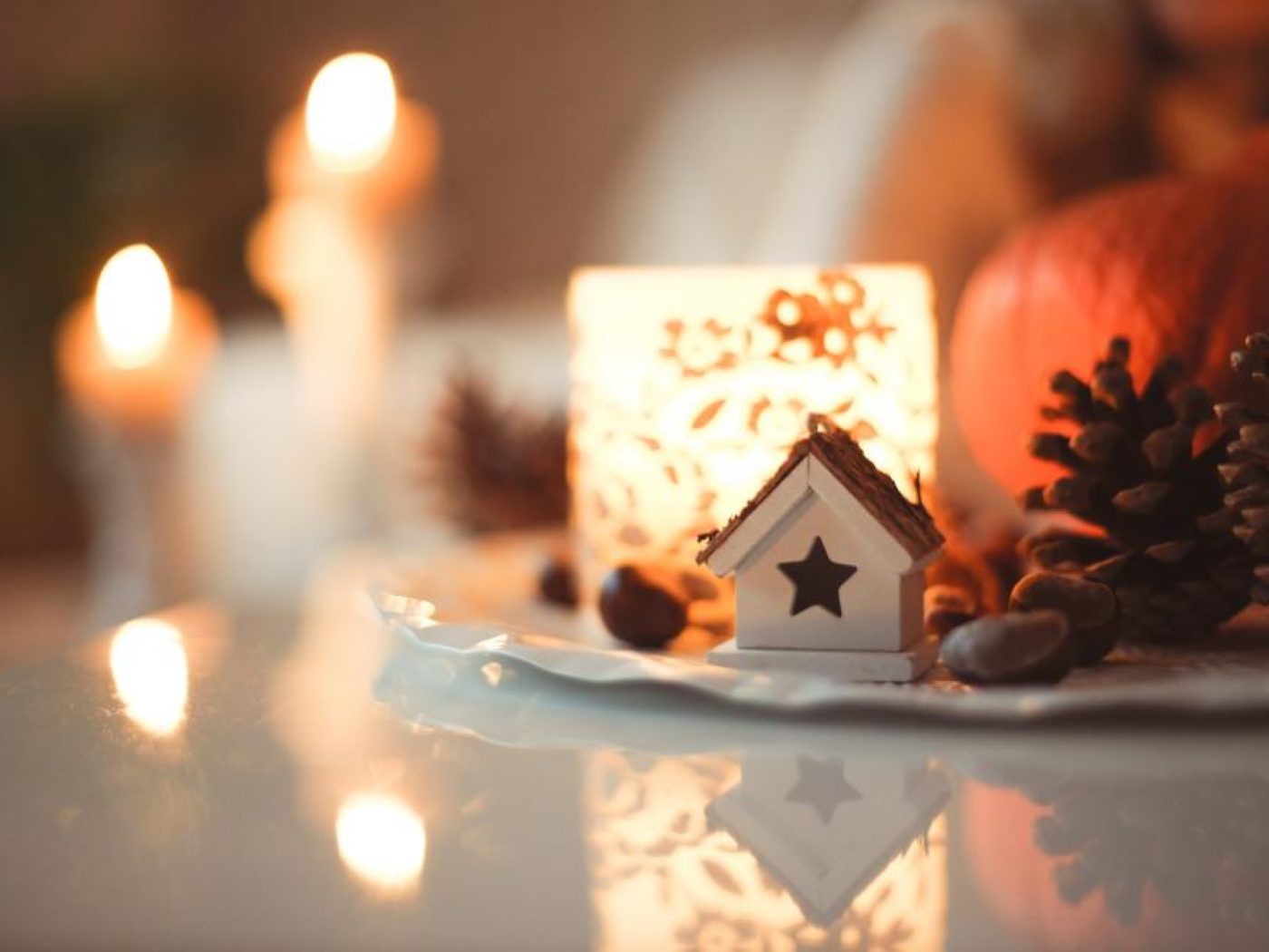 Candles glowing warmly on a side table