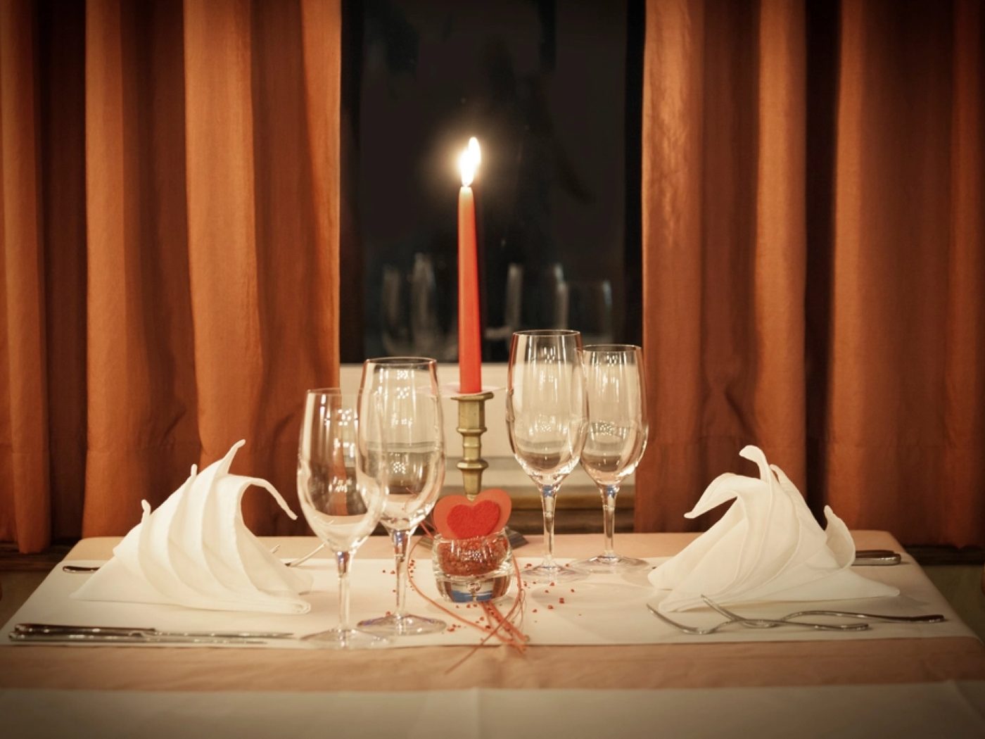 A table set with candles for two