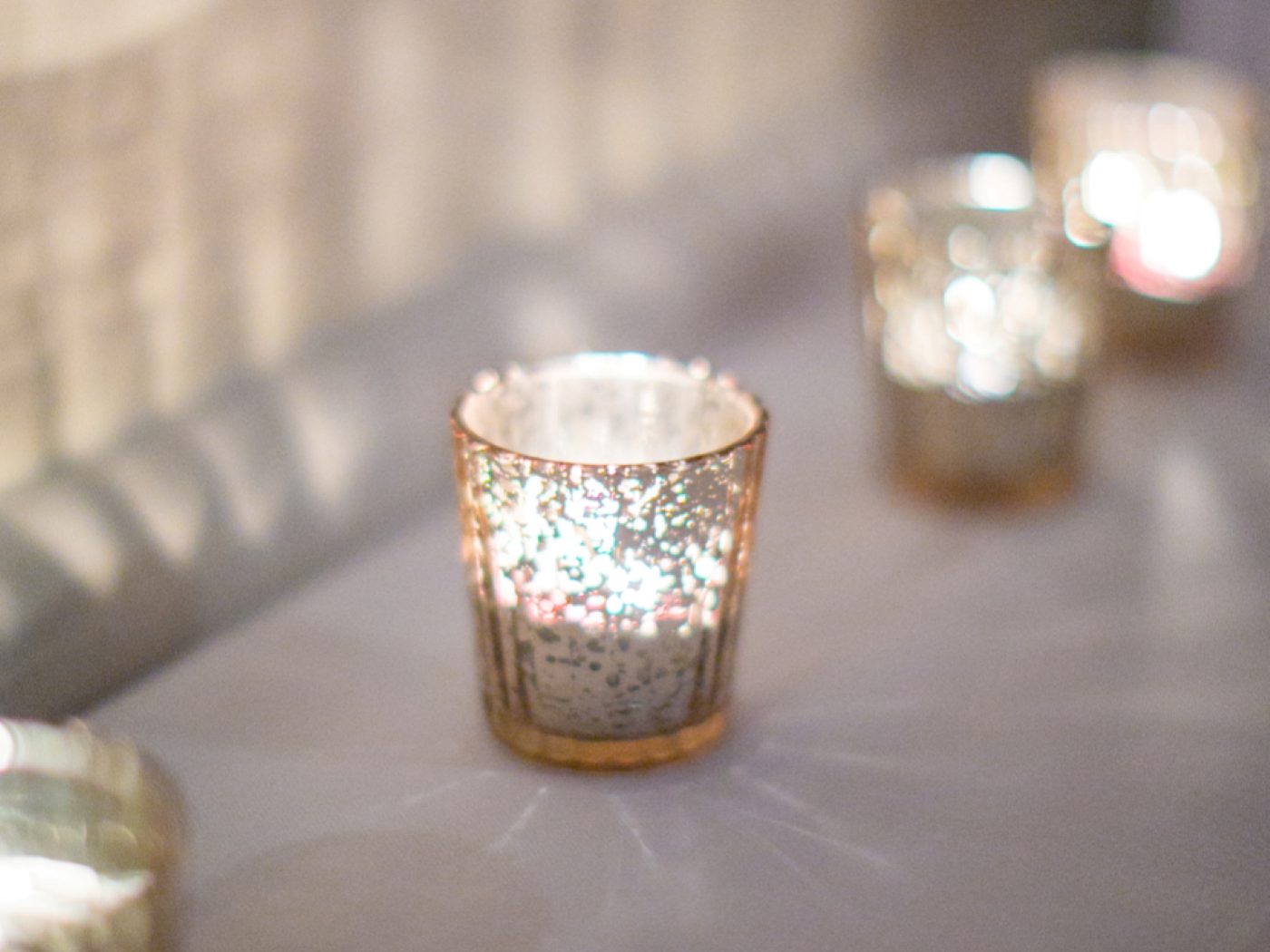 Tealight candles glowing in soft focus