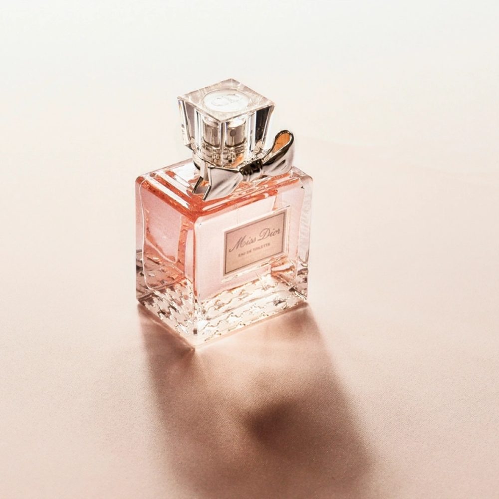 A crystal fragrance bottle in soft light