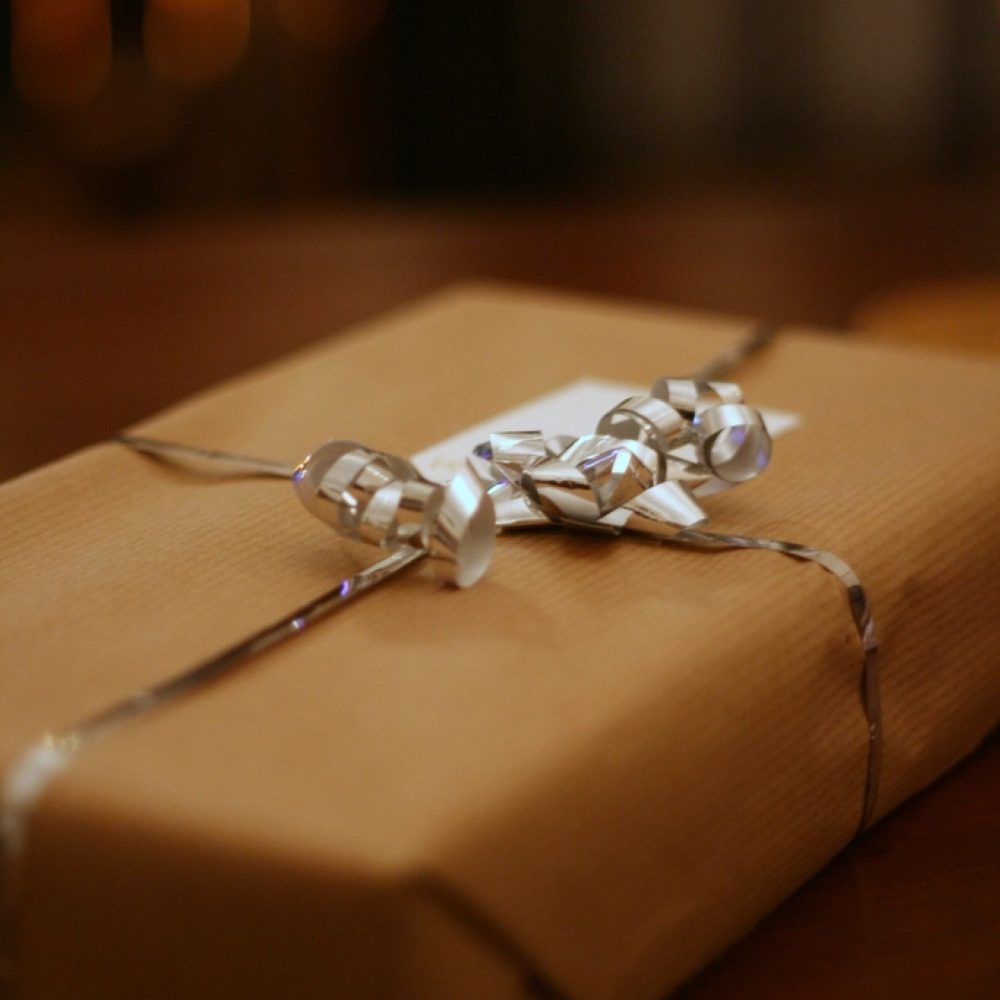 A gift wrapped in kraft paper and tied with twine