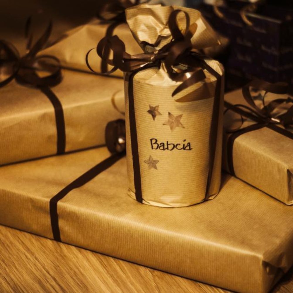 Gifts wrapped in kraft paper and gold ribbon